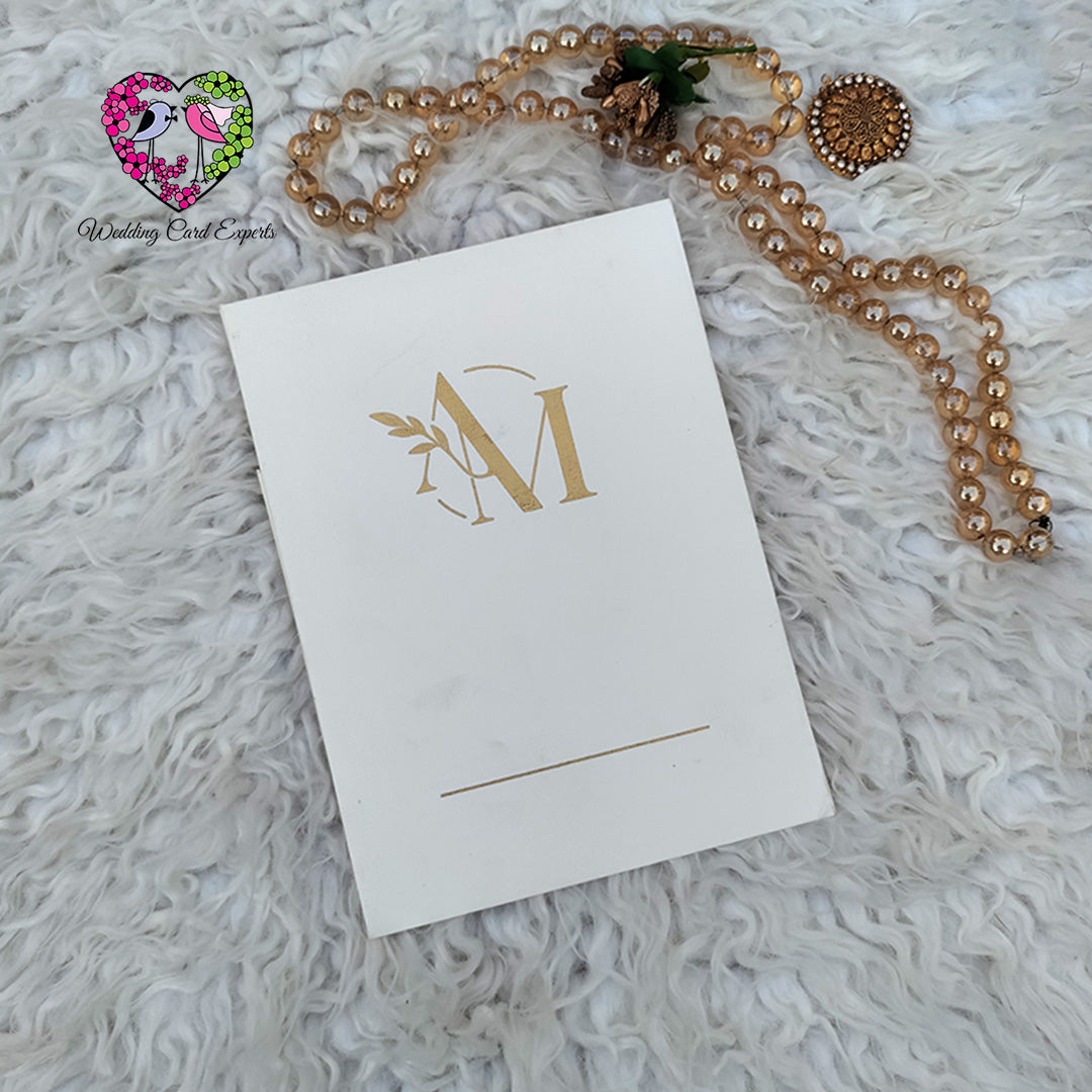 Gold monogram wedding invitation cover with initials on ivory cardstock, Wedding Card Pakistan