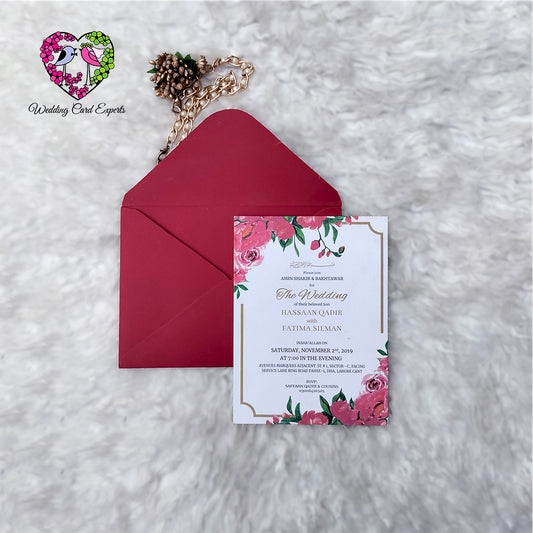 Full pink peony floral wedding card design, top and bottom corner florals, gold border, crimson envelope, Pakistani wedding cards online, Wedding Card Experts
