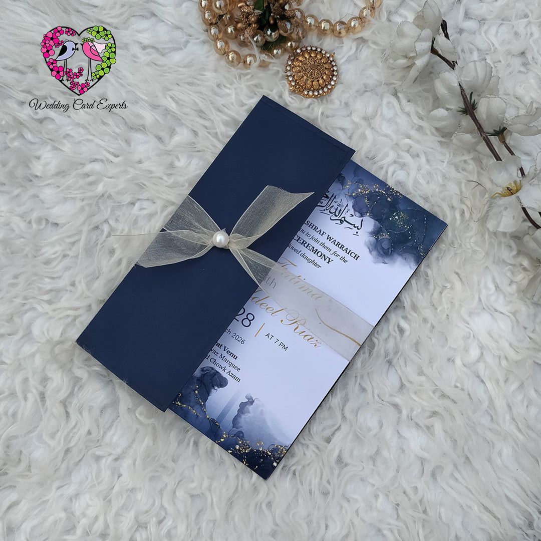 Wedding cards from Pakistan — navy watercolour ink wash barat card with gold glitter, Bismillah calligraphy and couple silhouette, Wedding Card Experts DHA Lahore