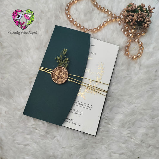 Green and gold luxury wedding invitation card, dark green envelope, rose wax seal, gold twine, dried flowers, Wedding Card Experts Pakistan