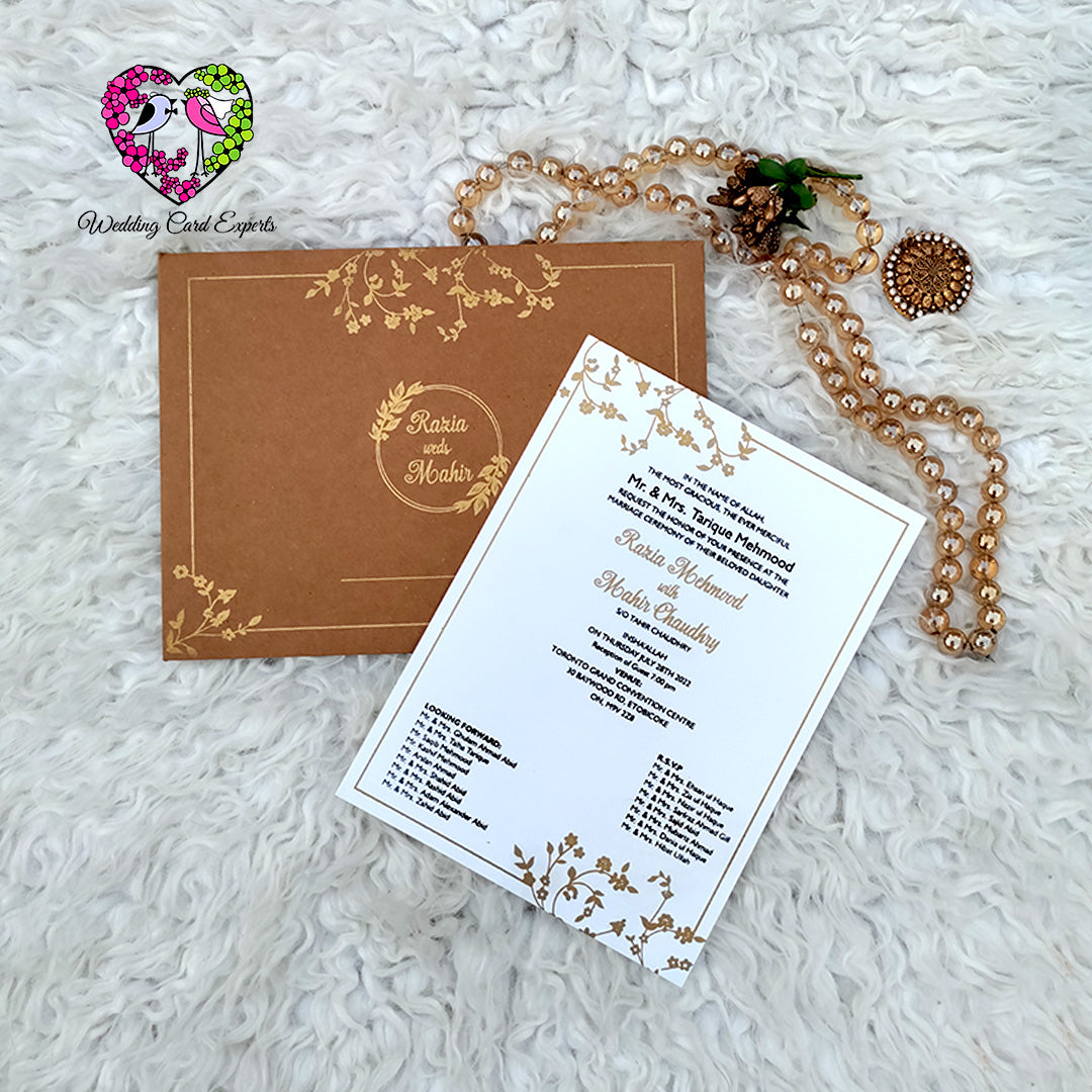 Pakistani wedding card — rustic kraft folder with gold printed vine border and couple name wreath beside pearl finish invitation card with gold botanical frame, wedding cards Pakistan