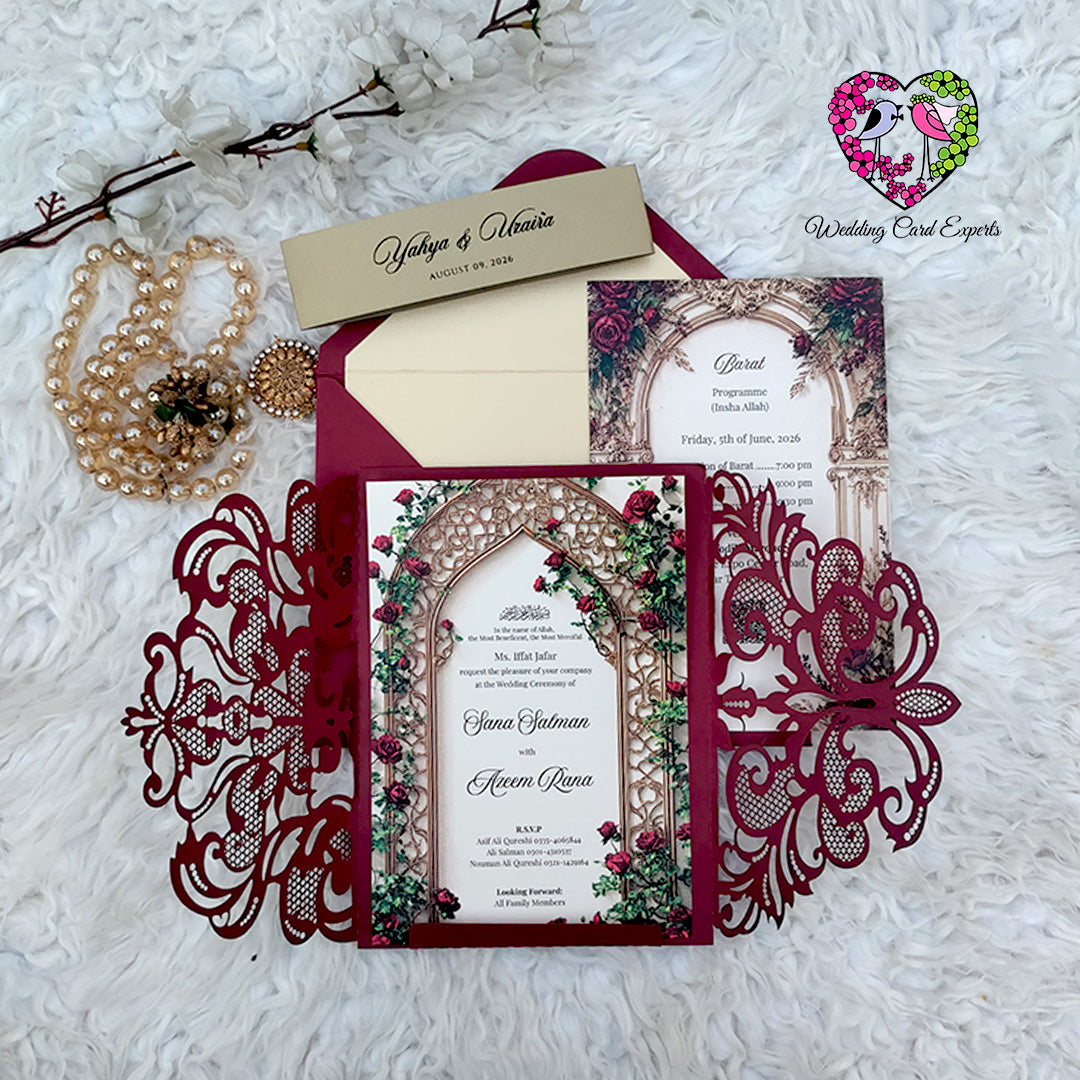 Open view of burgundy laser cut gatefold wedding card showing floral rose garden printed inner card and barat programme