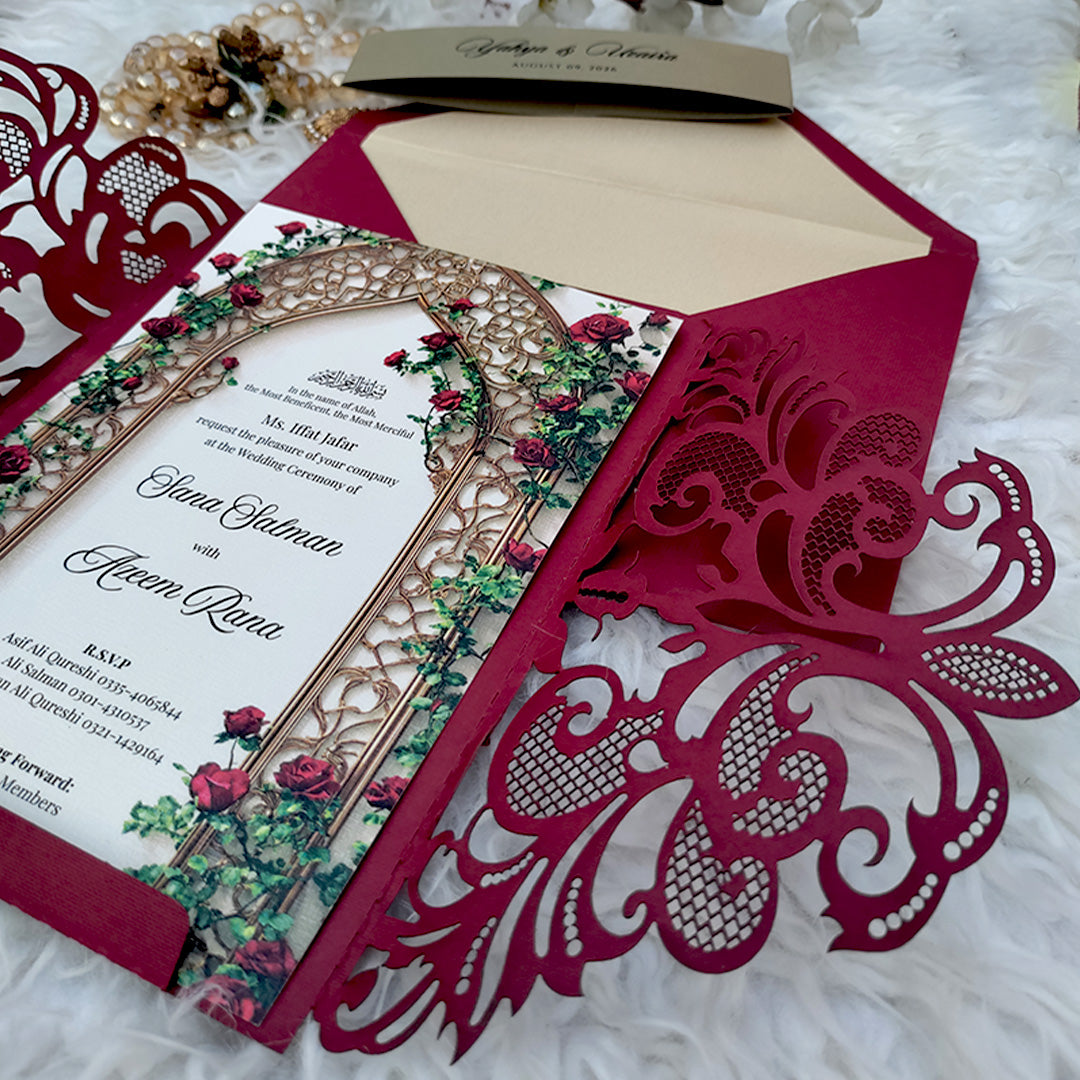 Close-up of Pakistani wedding invitation inner card with Mughal arch and climbing rose garden floral print design